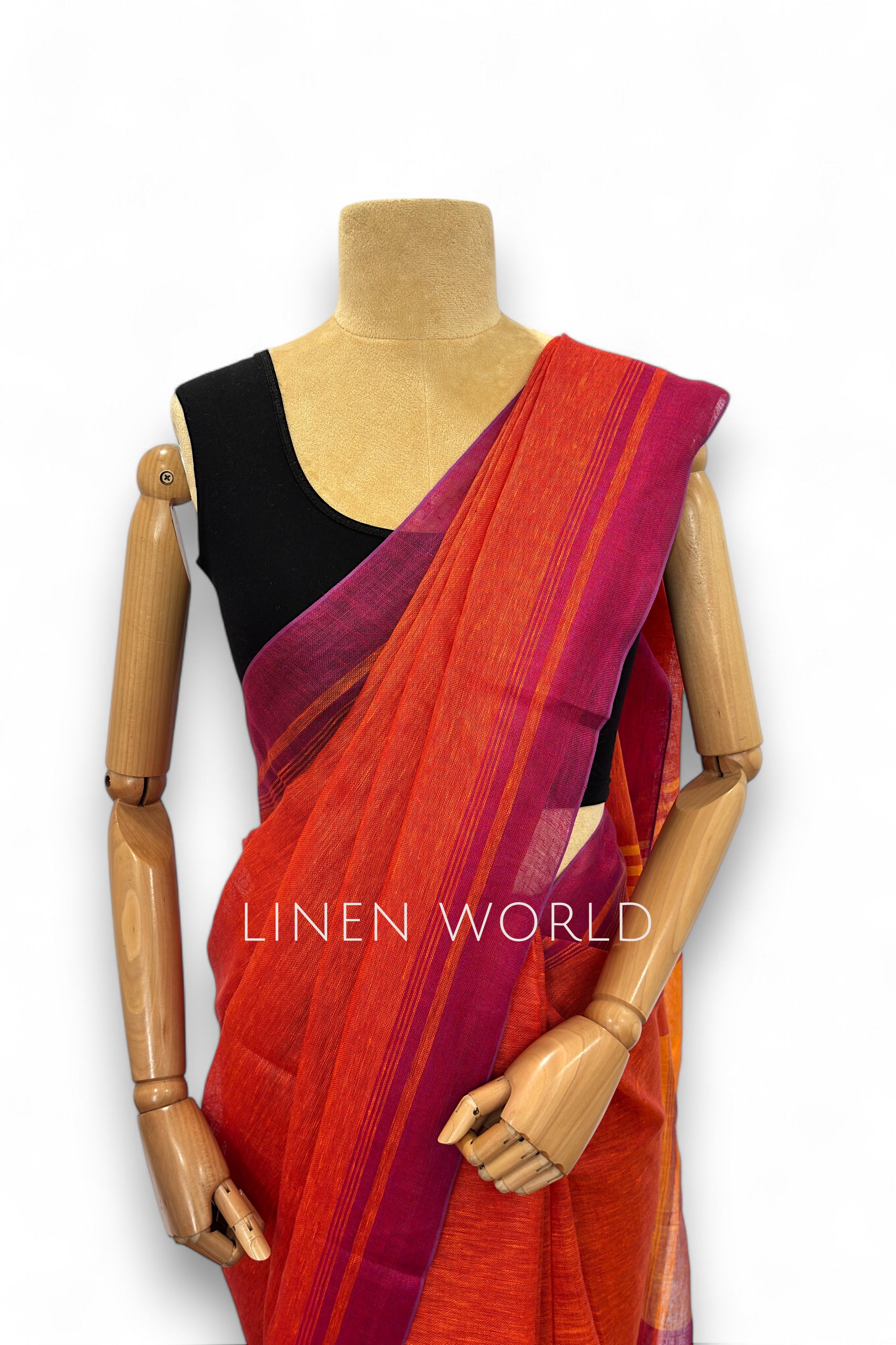 Office and daily wear orange linen saree with tassels branded 'Linen World'.
