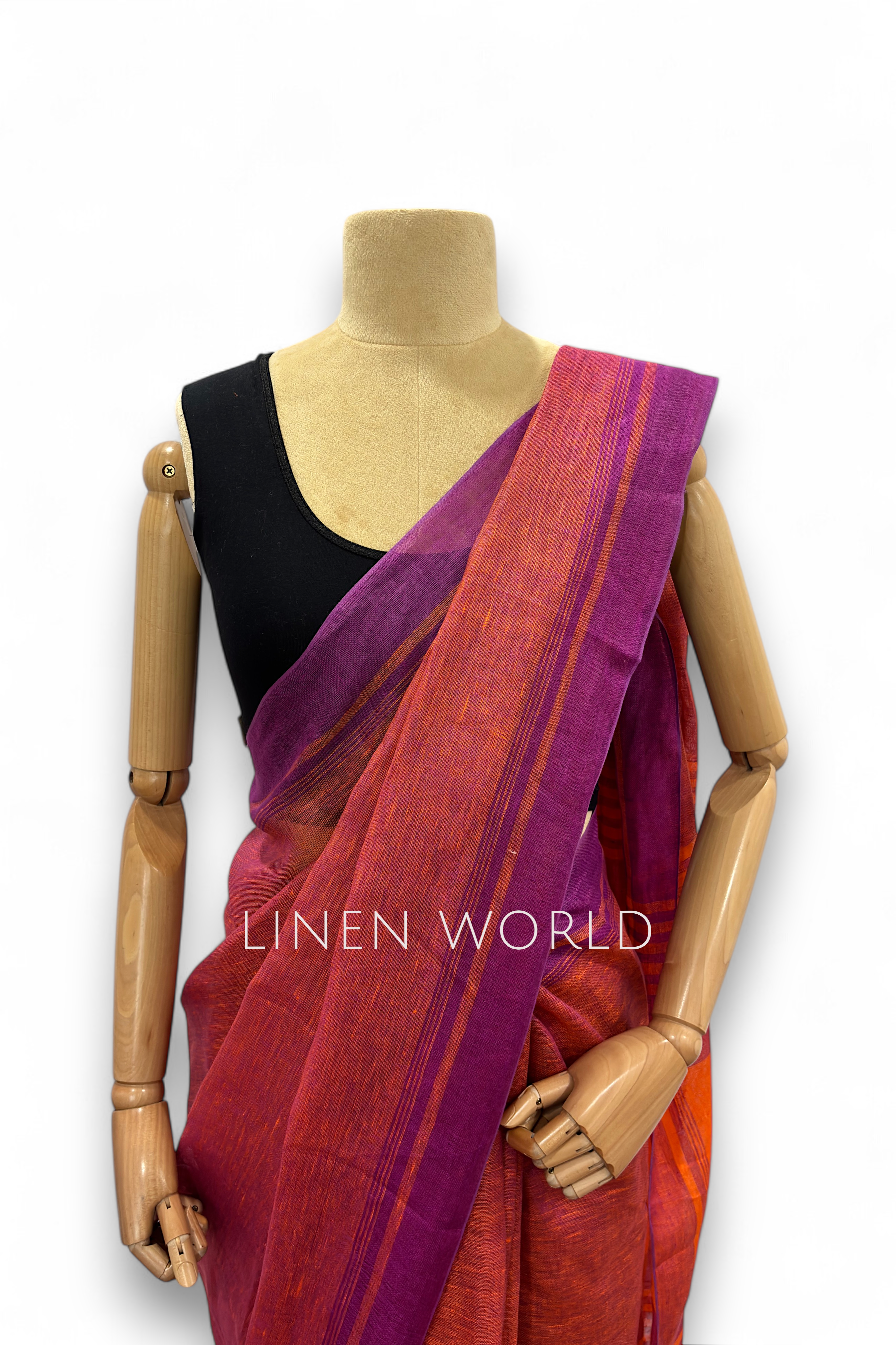 Office and daily wear purple linen saree with tassels branded 'Linen World'.