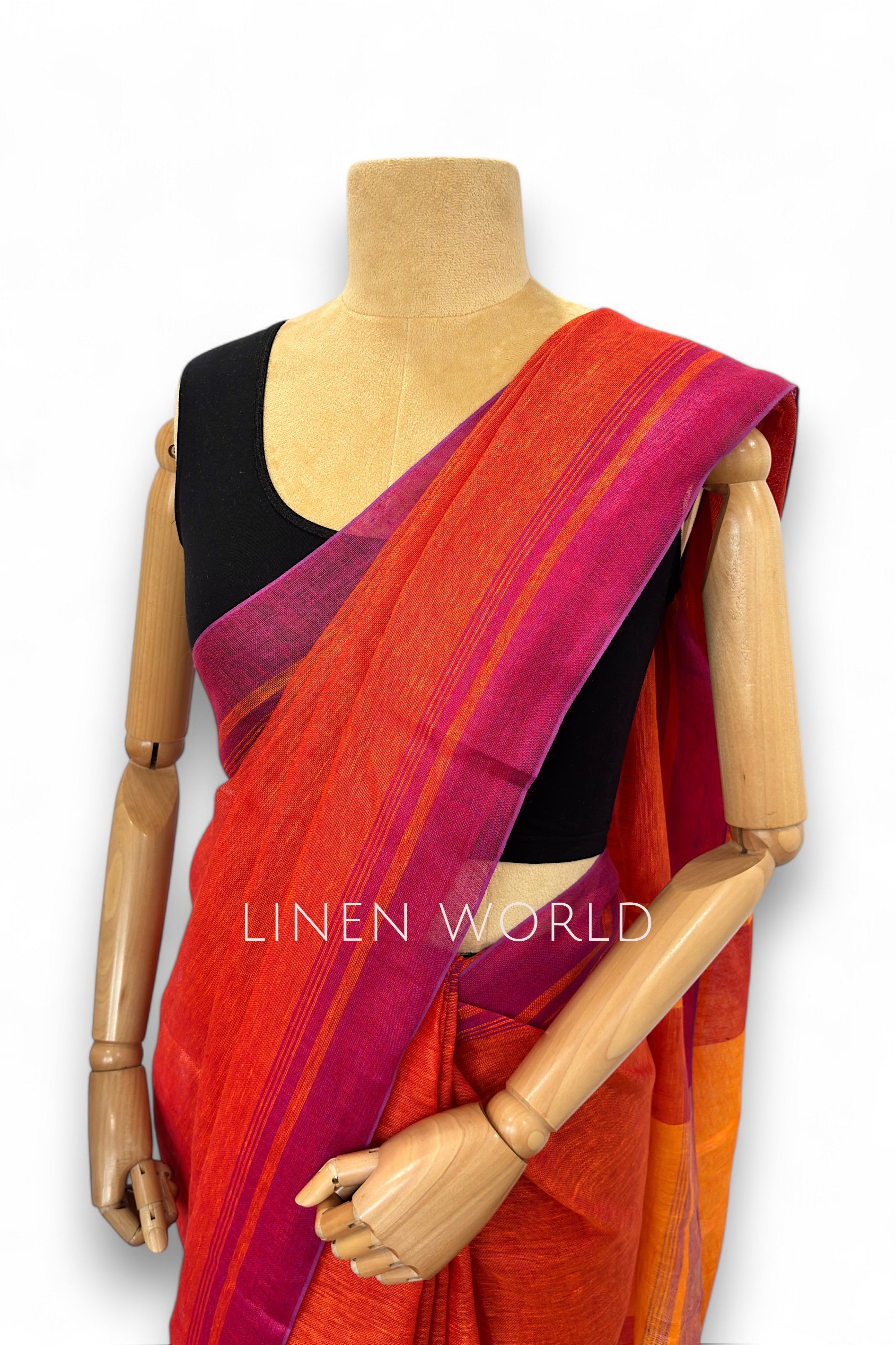 Office and daily wear orange linen saree with tassels branded 'Linen World'.