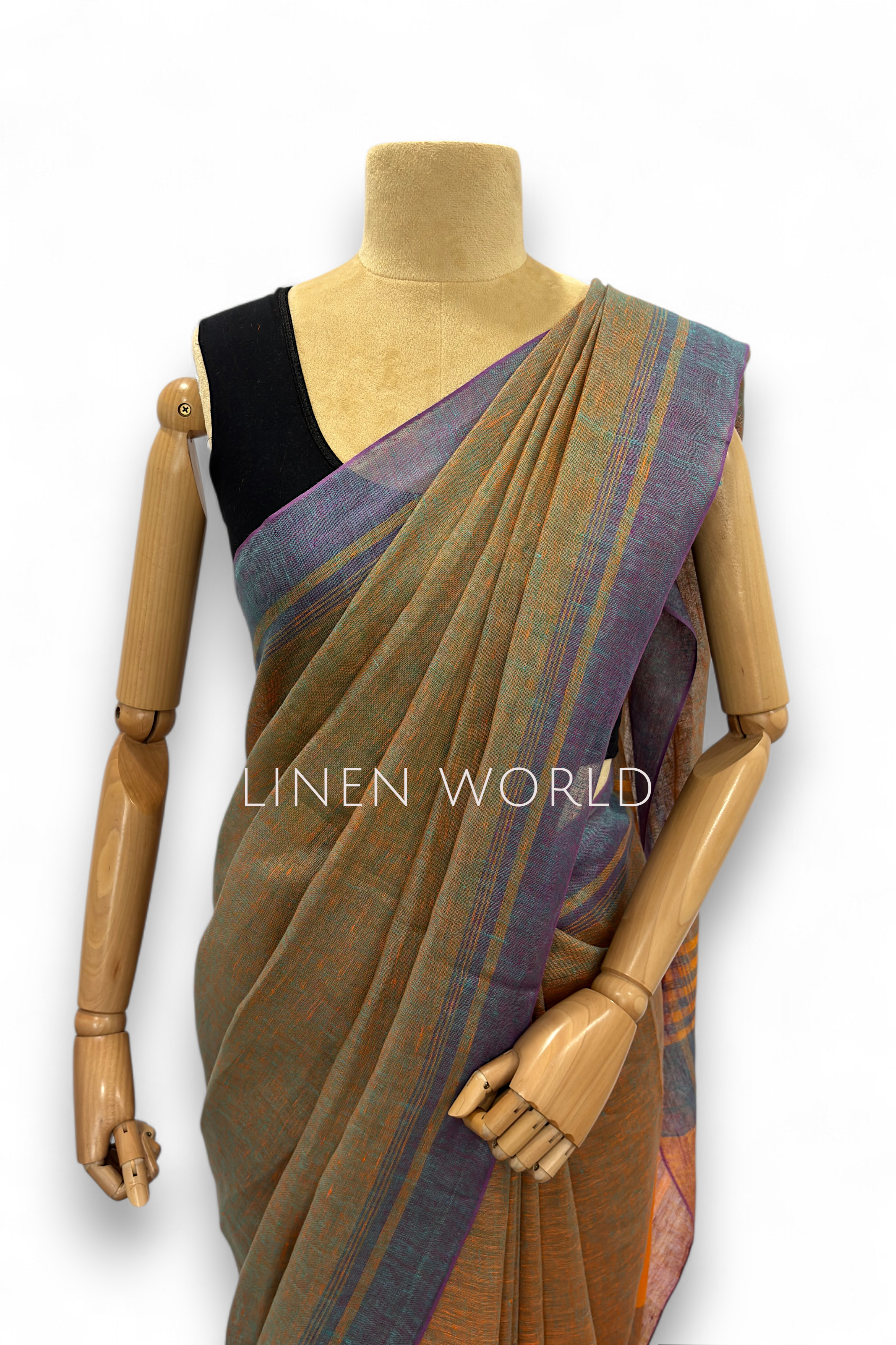 Office and daily wear green pure linen saree with tassels branded 'Linen World'.