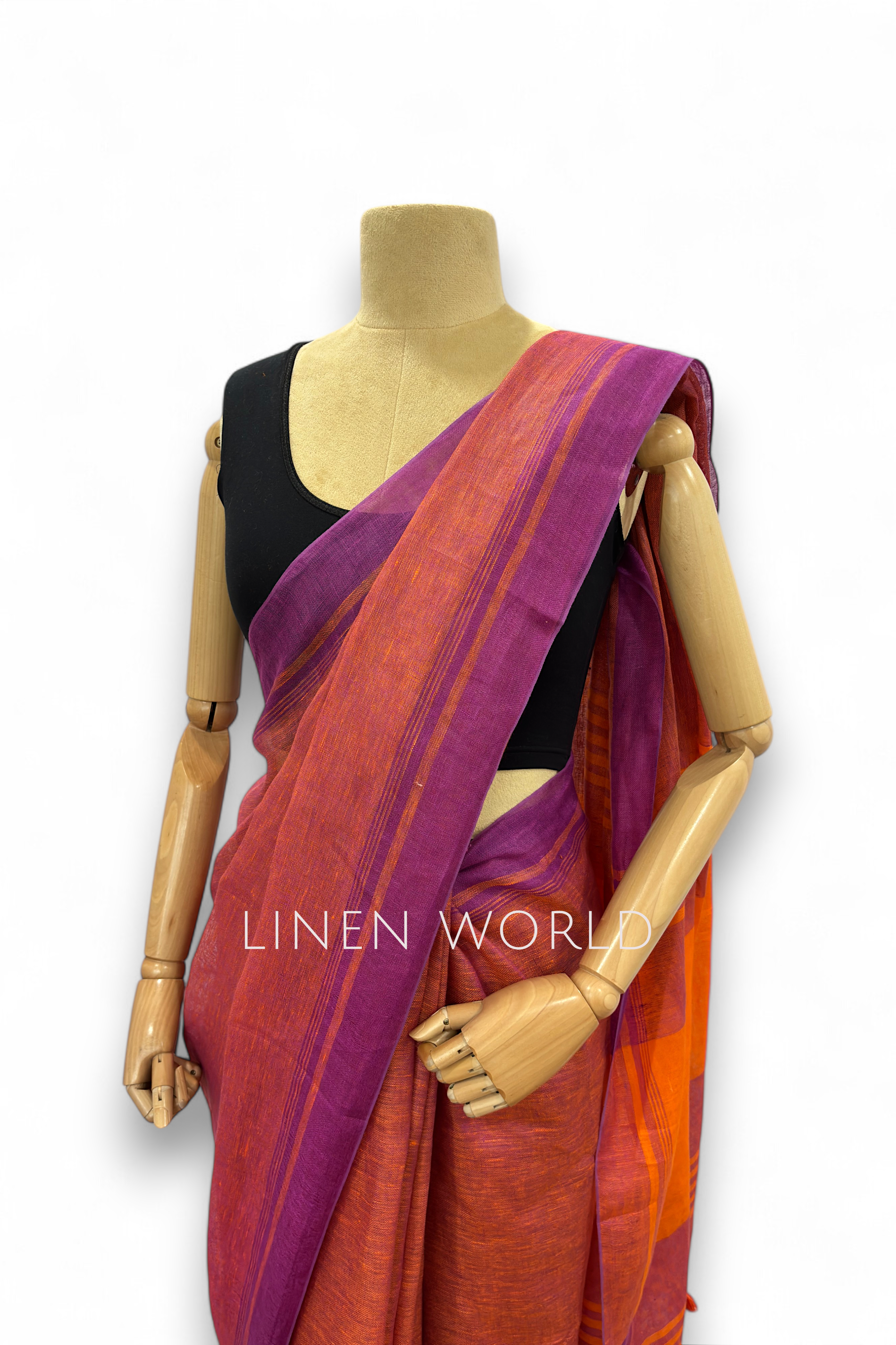 Office and daily wear purple linen saree with tassels branded 'Linen World'.