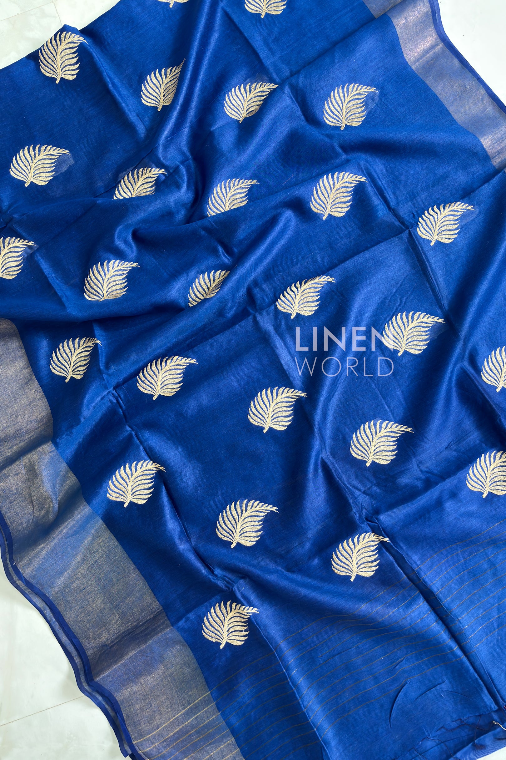 Soft textured fabric of Royal Blue Digital Embroidered Muga Silk Saree by Linen World