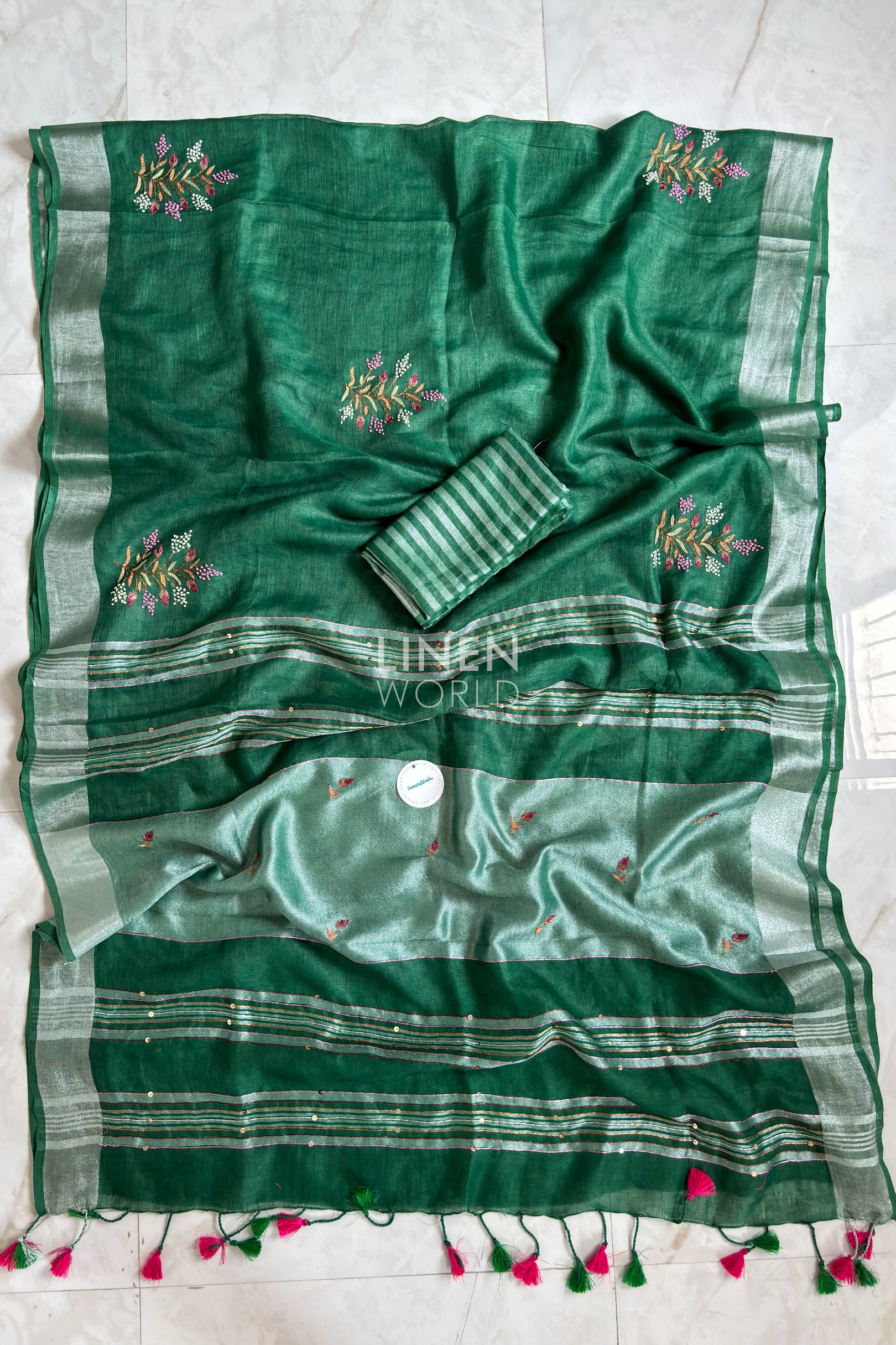 Green linen saree pallu showing intricate hand embroidery by Linen World