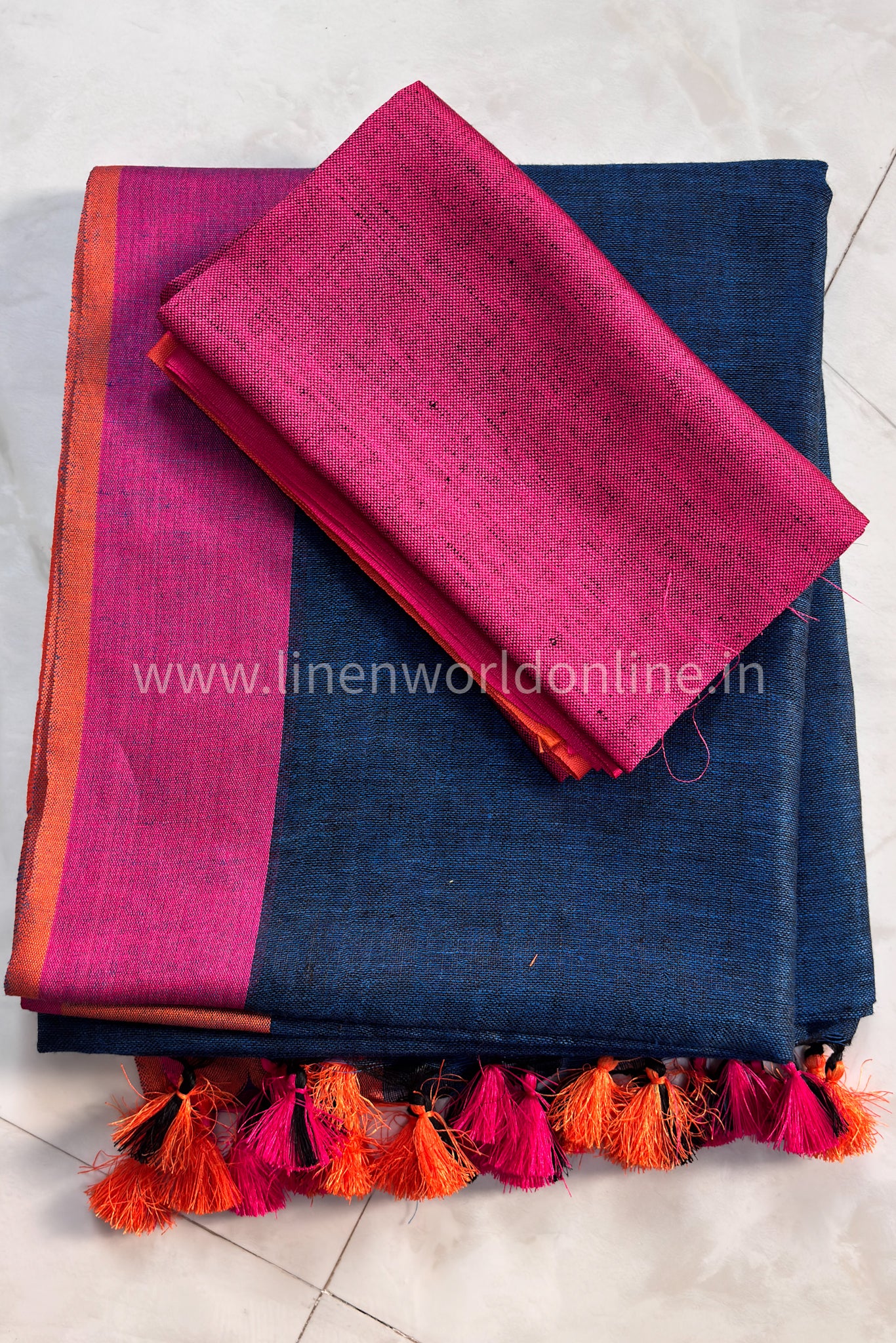 handloom midnight blue pure linen saree with pink and orange border and tassels - linenworldonline.in