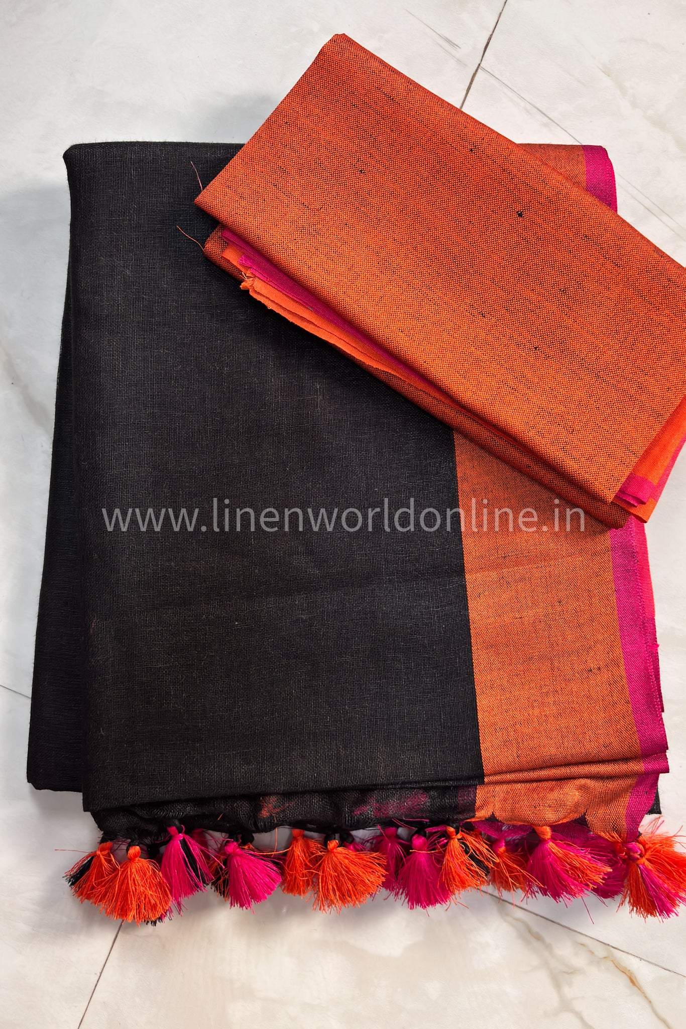 jet black handloom organic pure linen saree with pink and orange border and tassels - linenworldonline.in