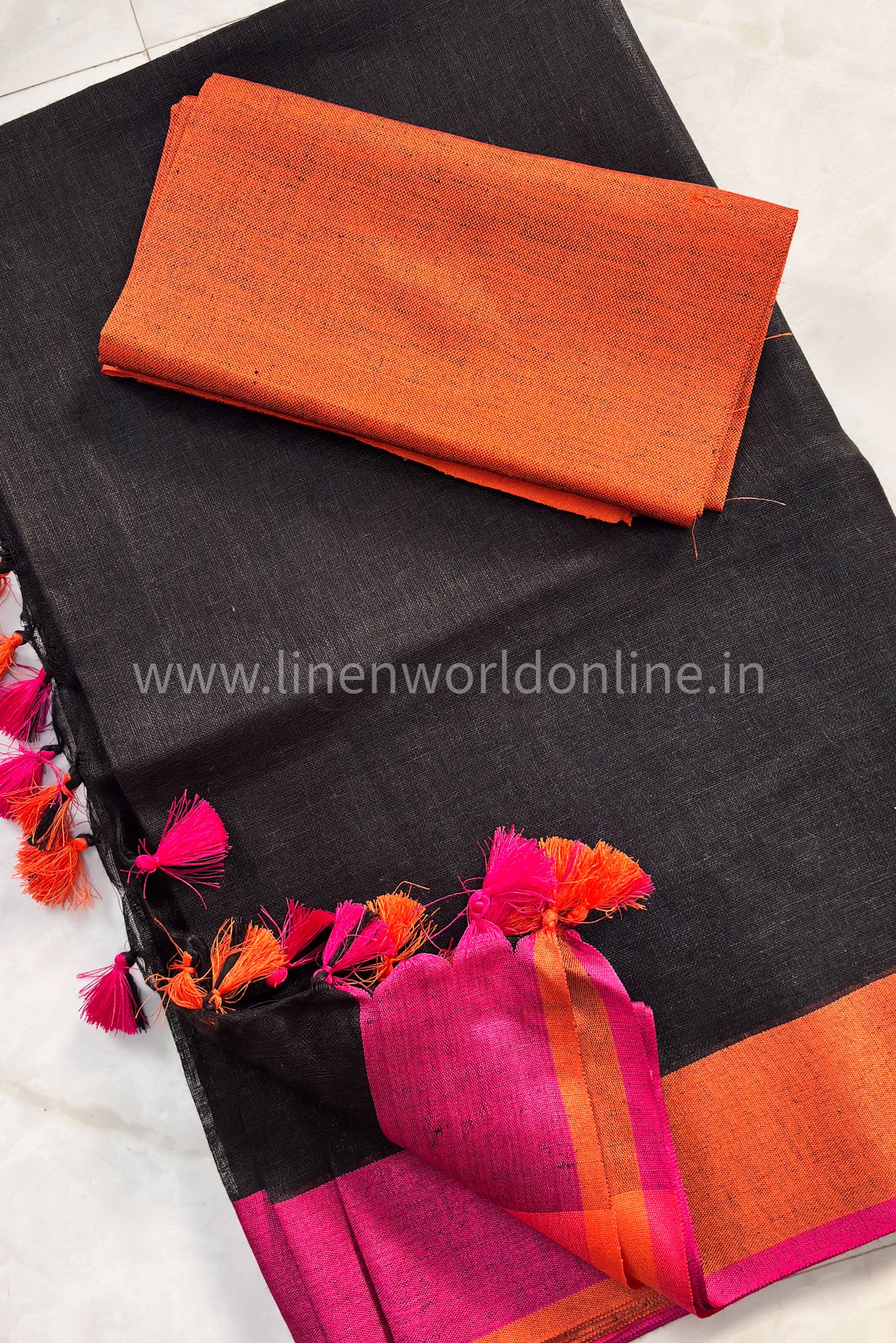 jet black handloom pure linen saree with pink and orange border and tassels - linenworldonline.in