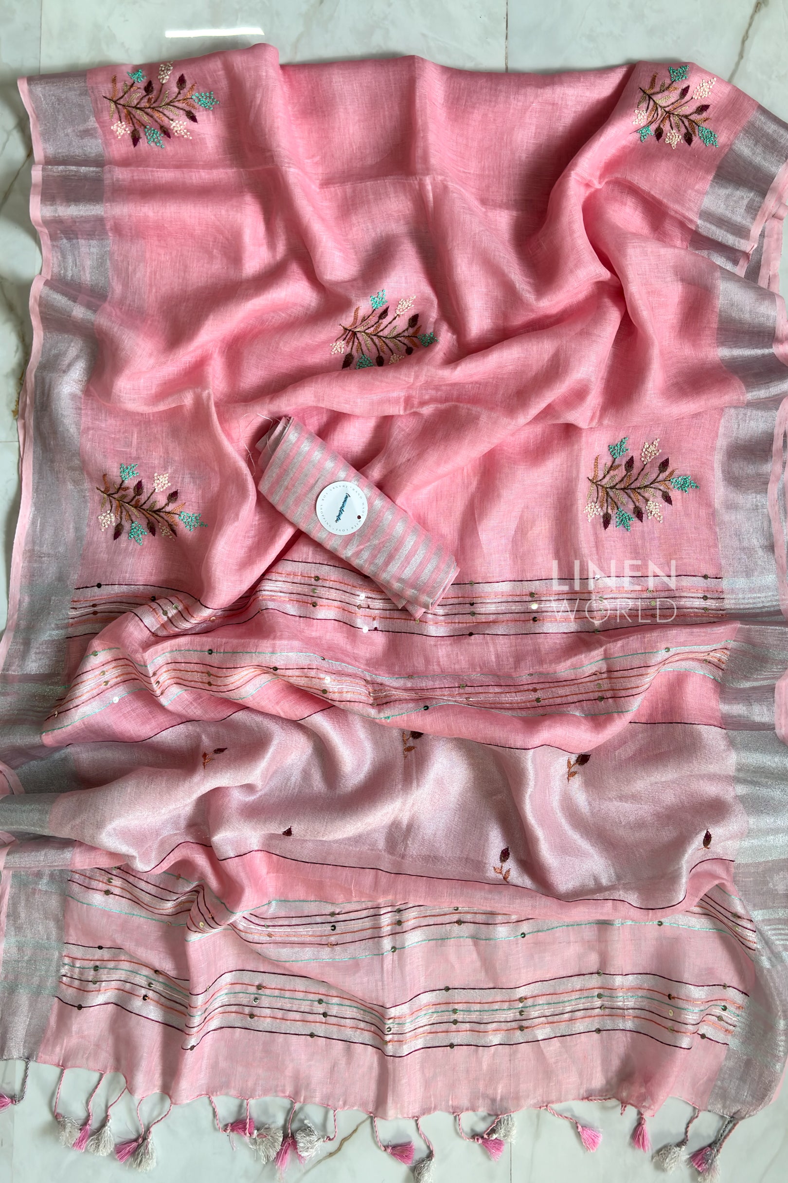 Pink linen saree pallu showing intricate hand embroidery by Linen World