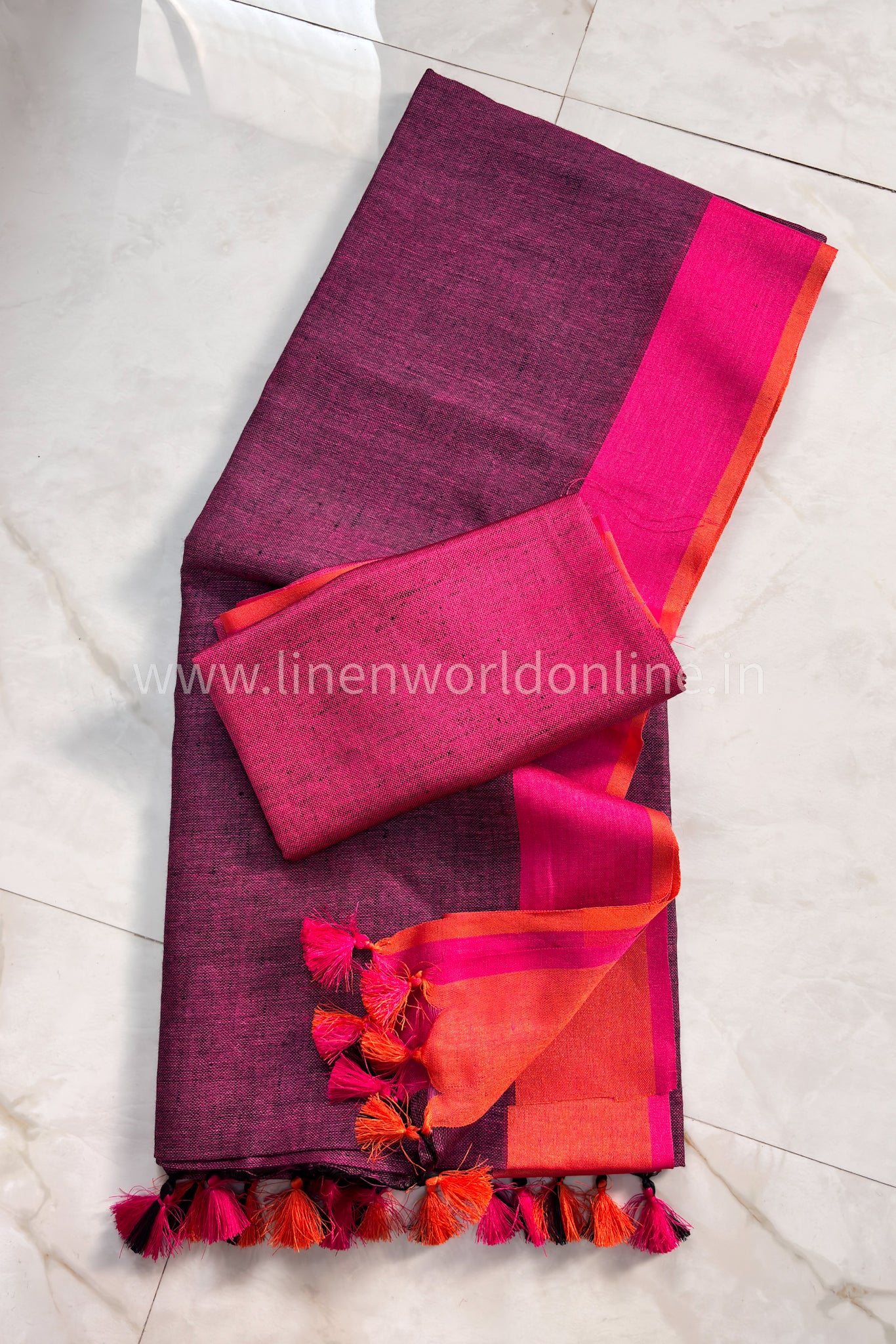 pink handloom pure linen saree with pink and orange border and tassels - linenworldonline.in