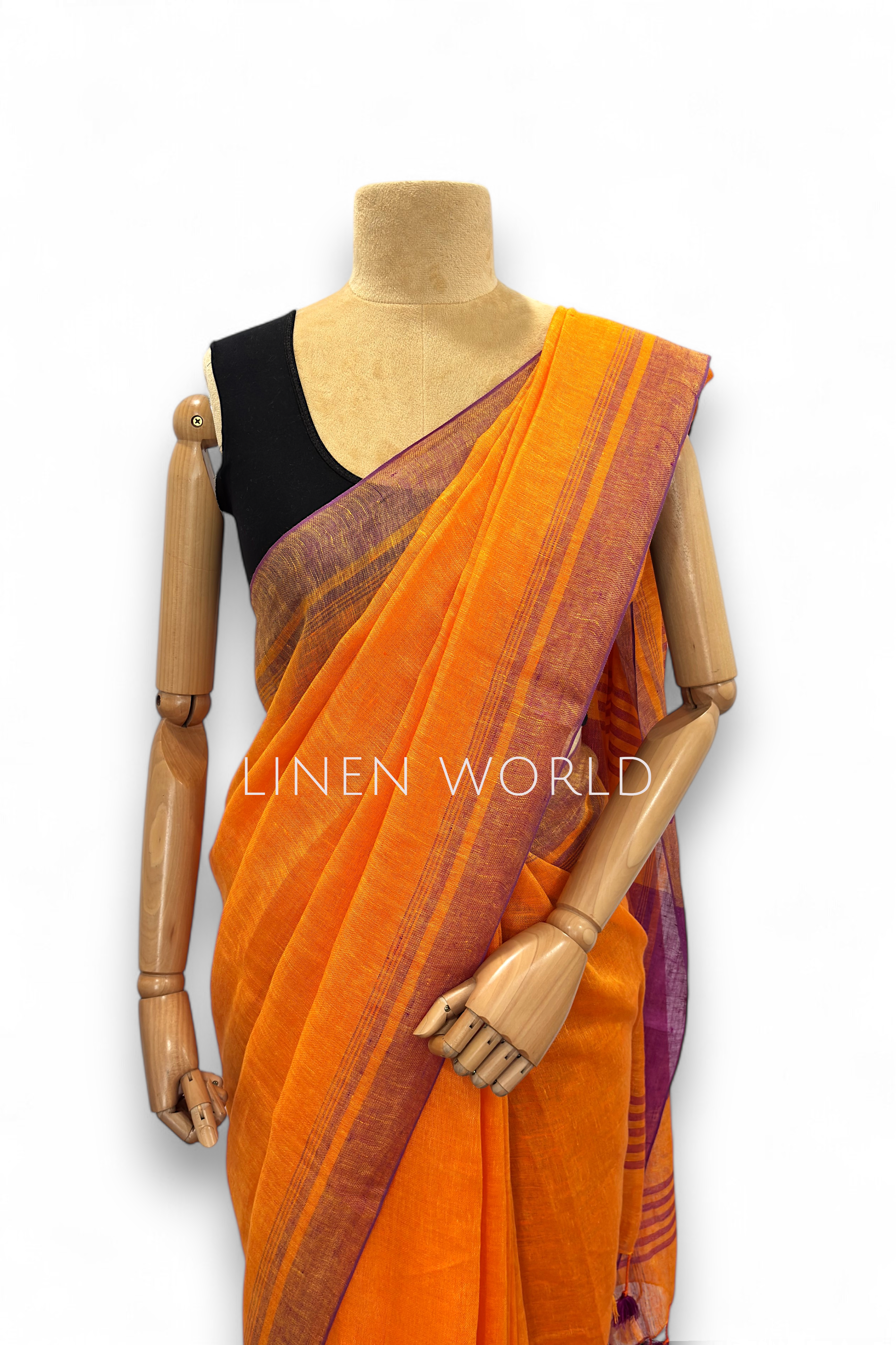 Office and daily wear orange linen saree with tassels branded 'Linen World'.