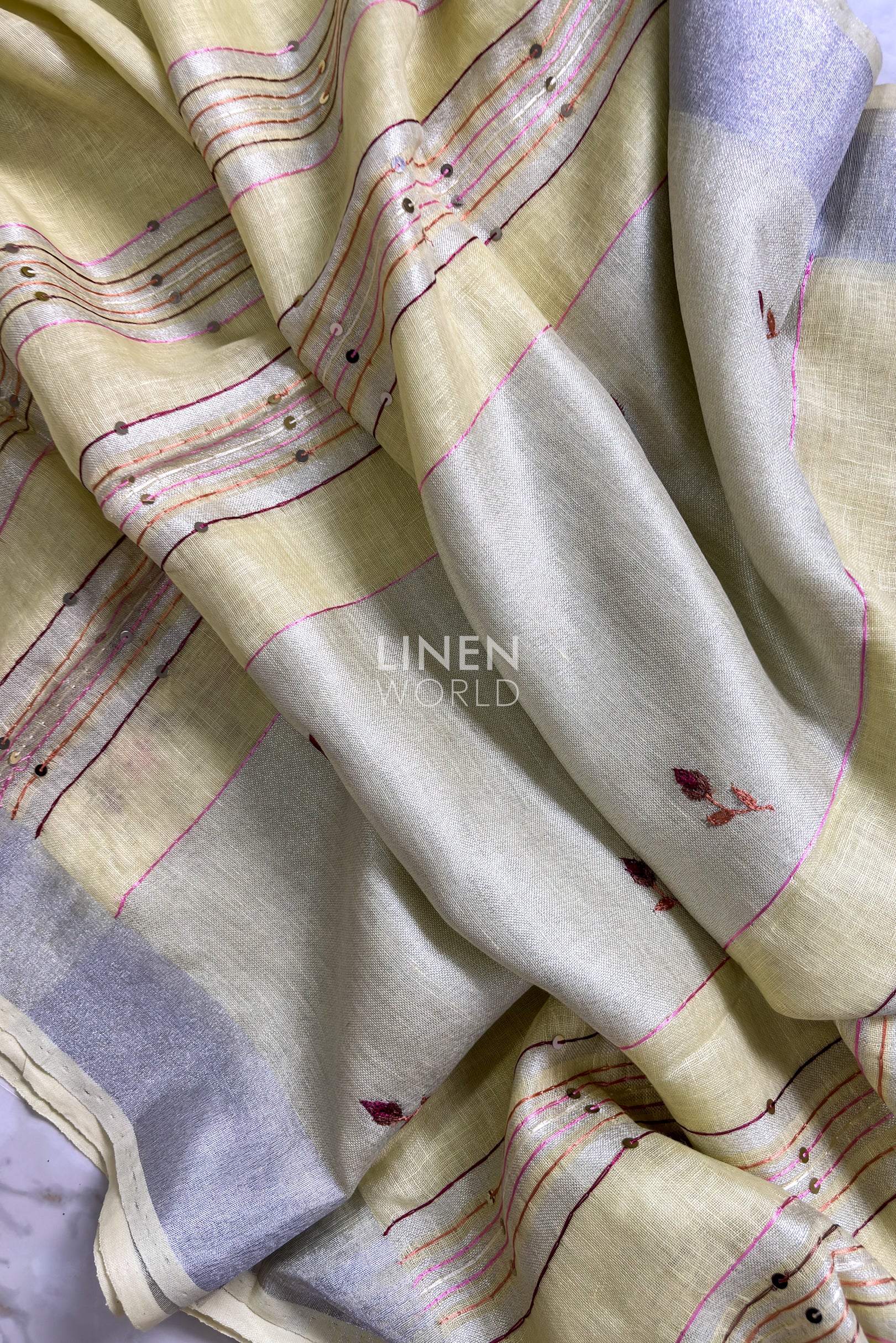 yellow linen saree pallu showing intricate hand embroidery - Linen World