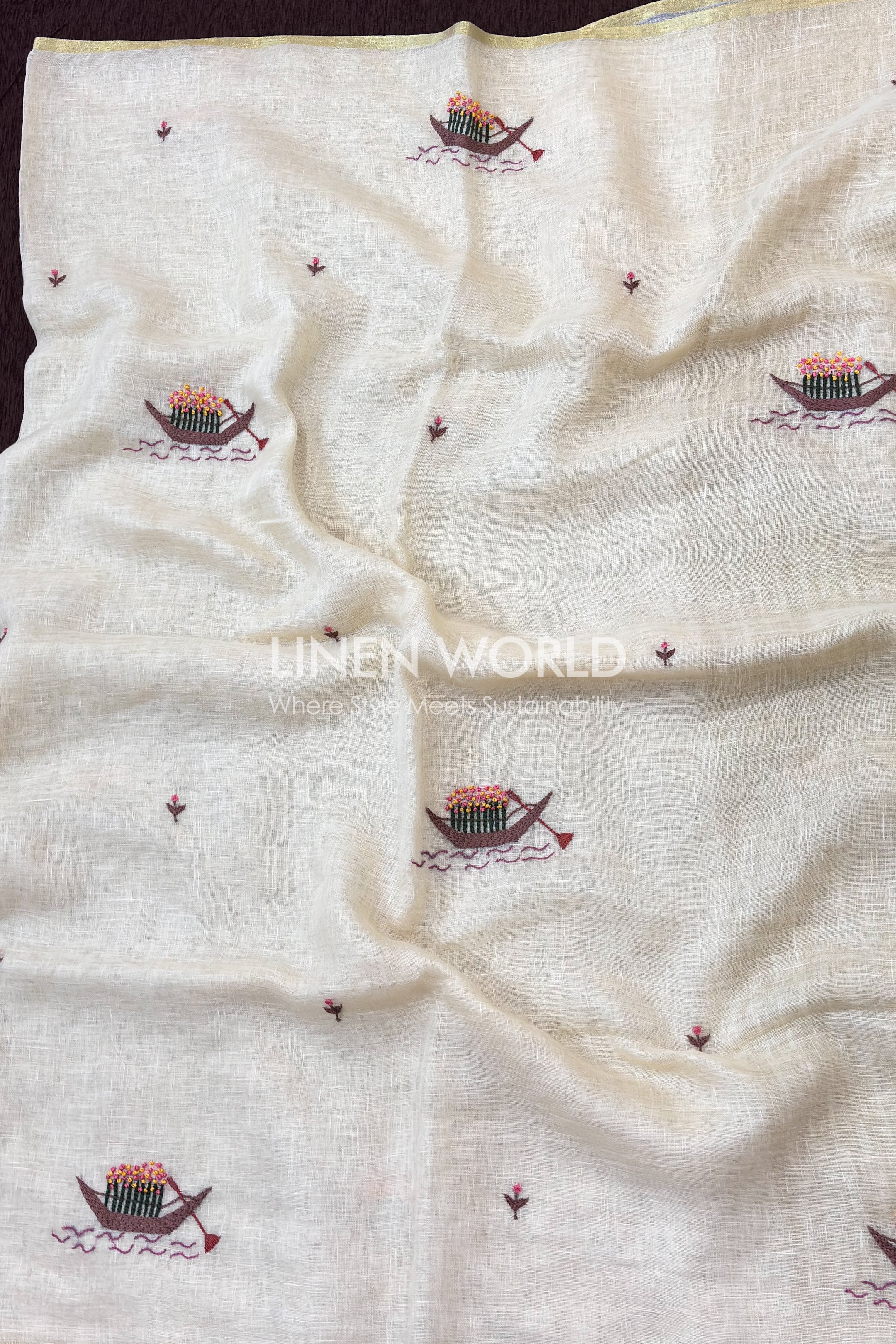Onam special pure linen saree with hand embroidered flower boat motif inspired by Kerala backwaters from linen world