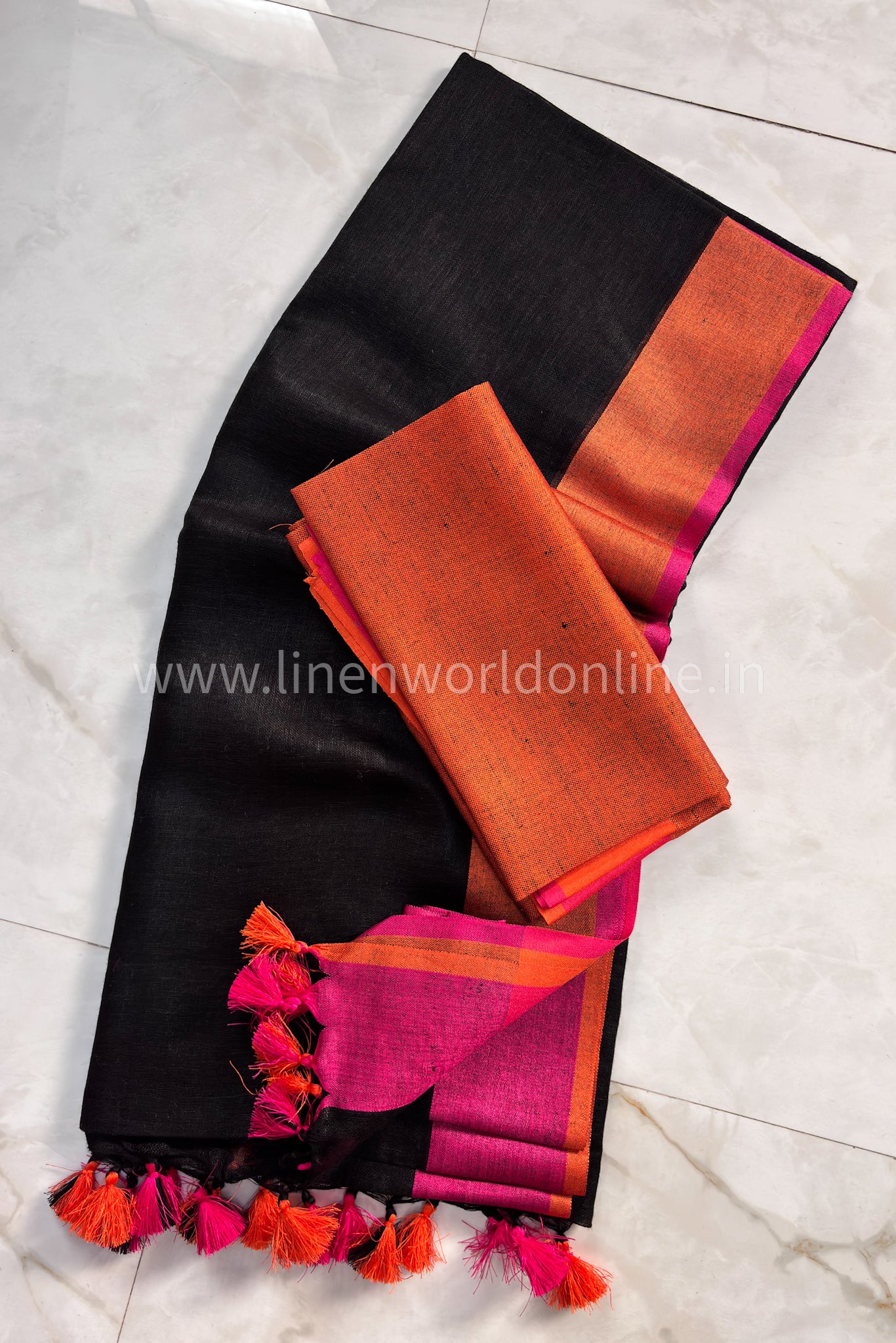 jet black handloom organic linen saree with pink and orange border and tassels - linenworldonline.in