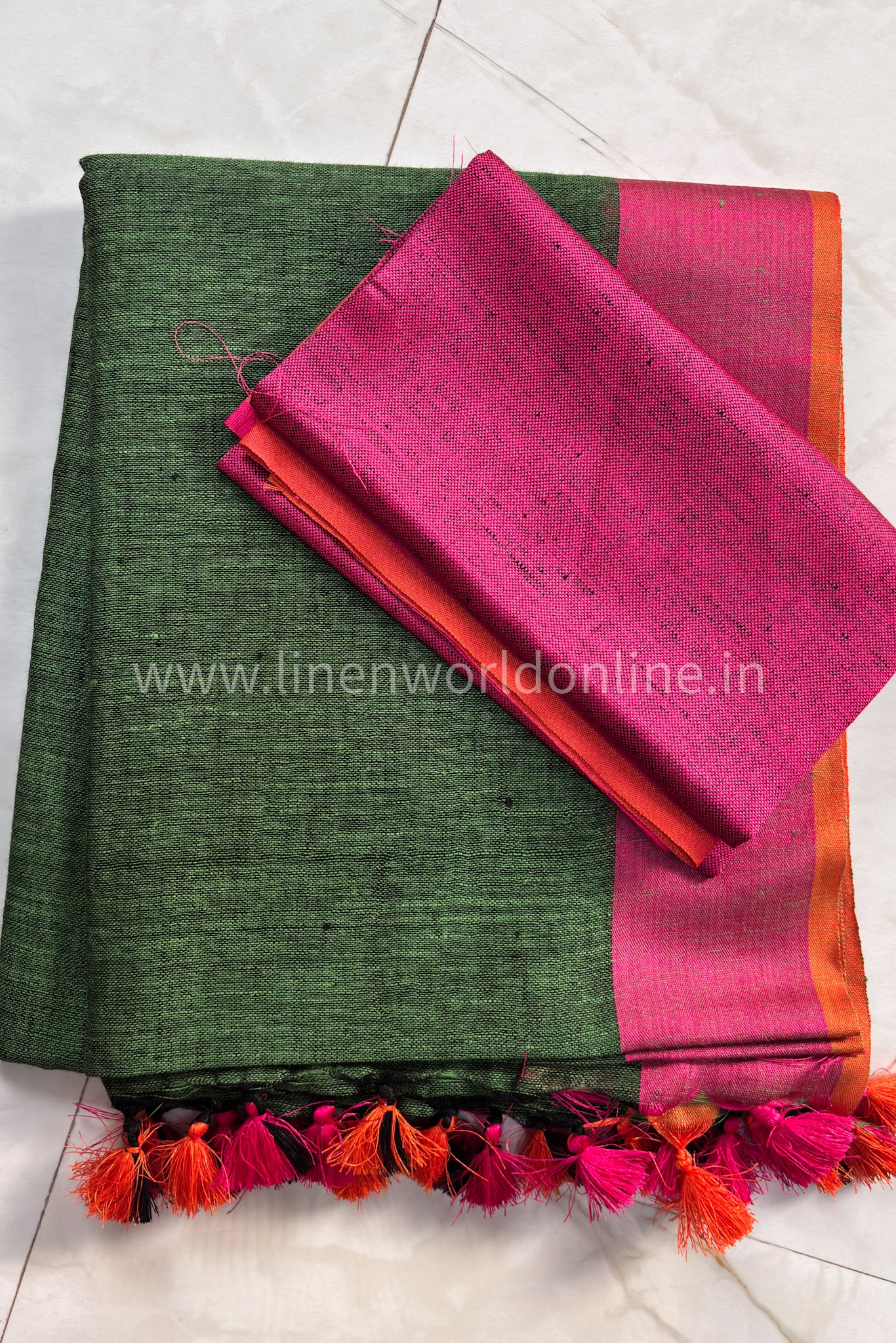 forest green handloom pure linen saree with pink and orange border and tassels - linenworldonline.in