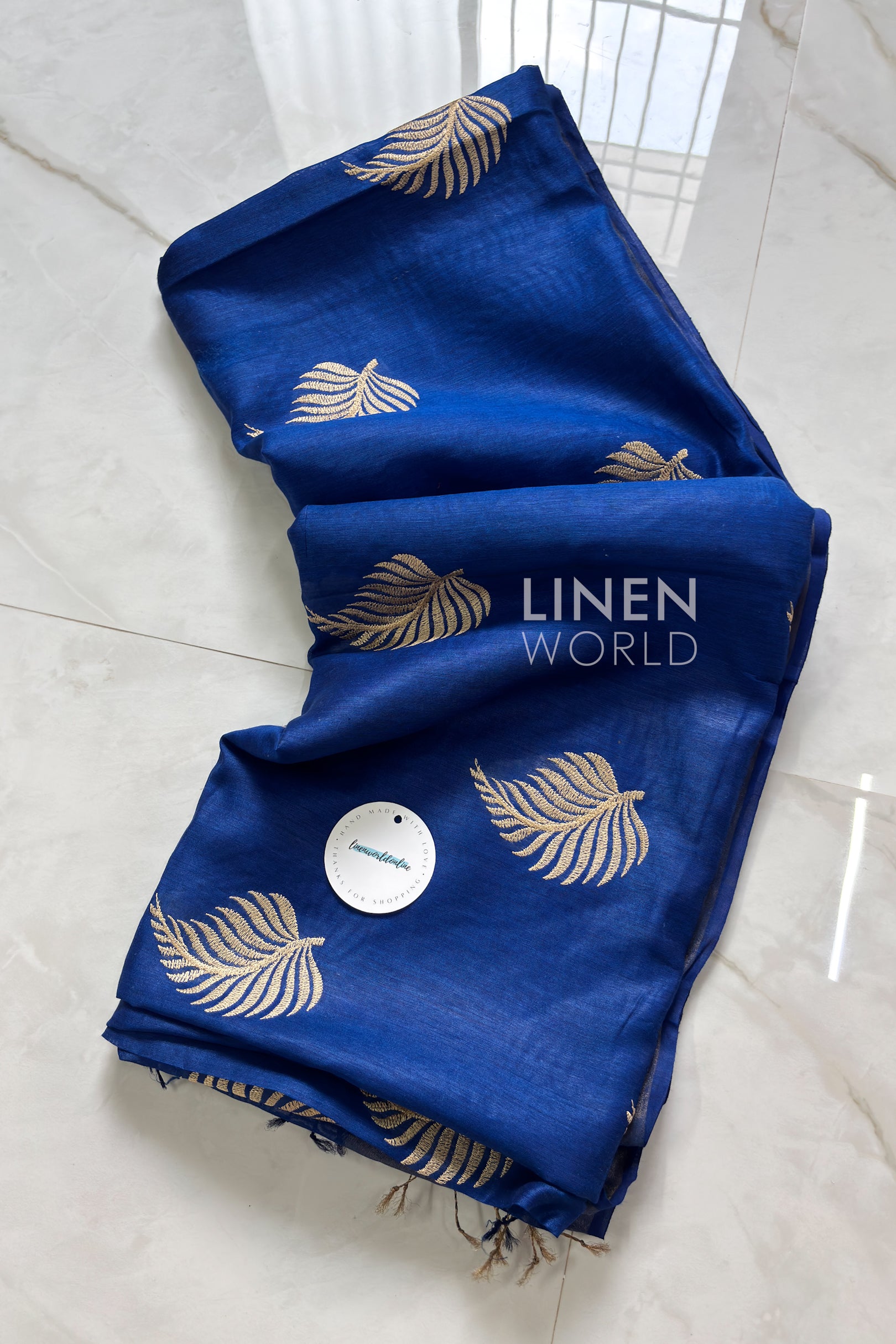 Handwoven Royal Blue Muga Silk Saree featuring elegant leaf digital embroidery by Linen World