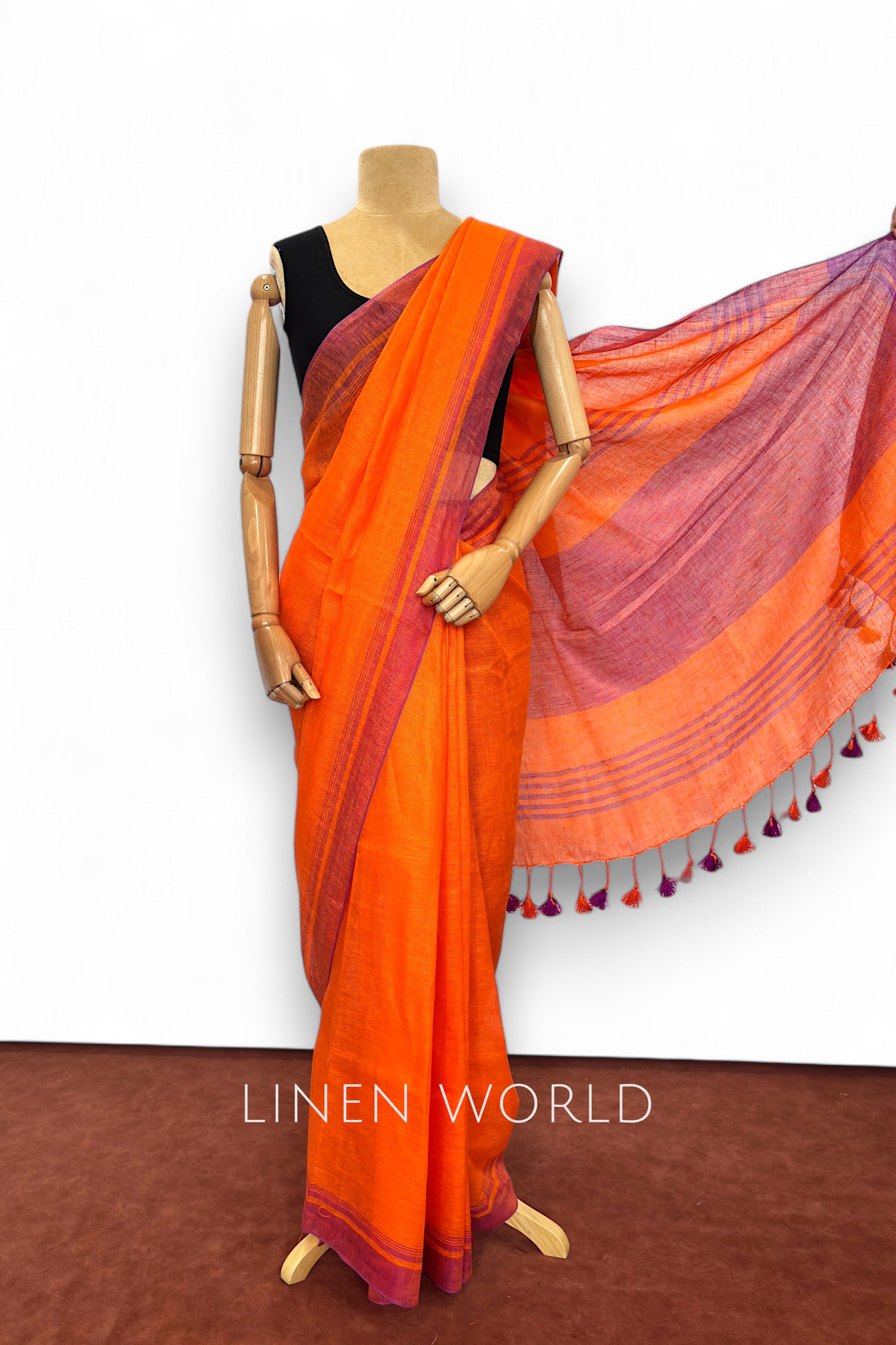 Dark orange linen saree with matching blouse piece by Linen World.