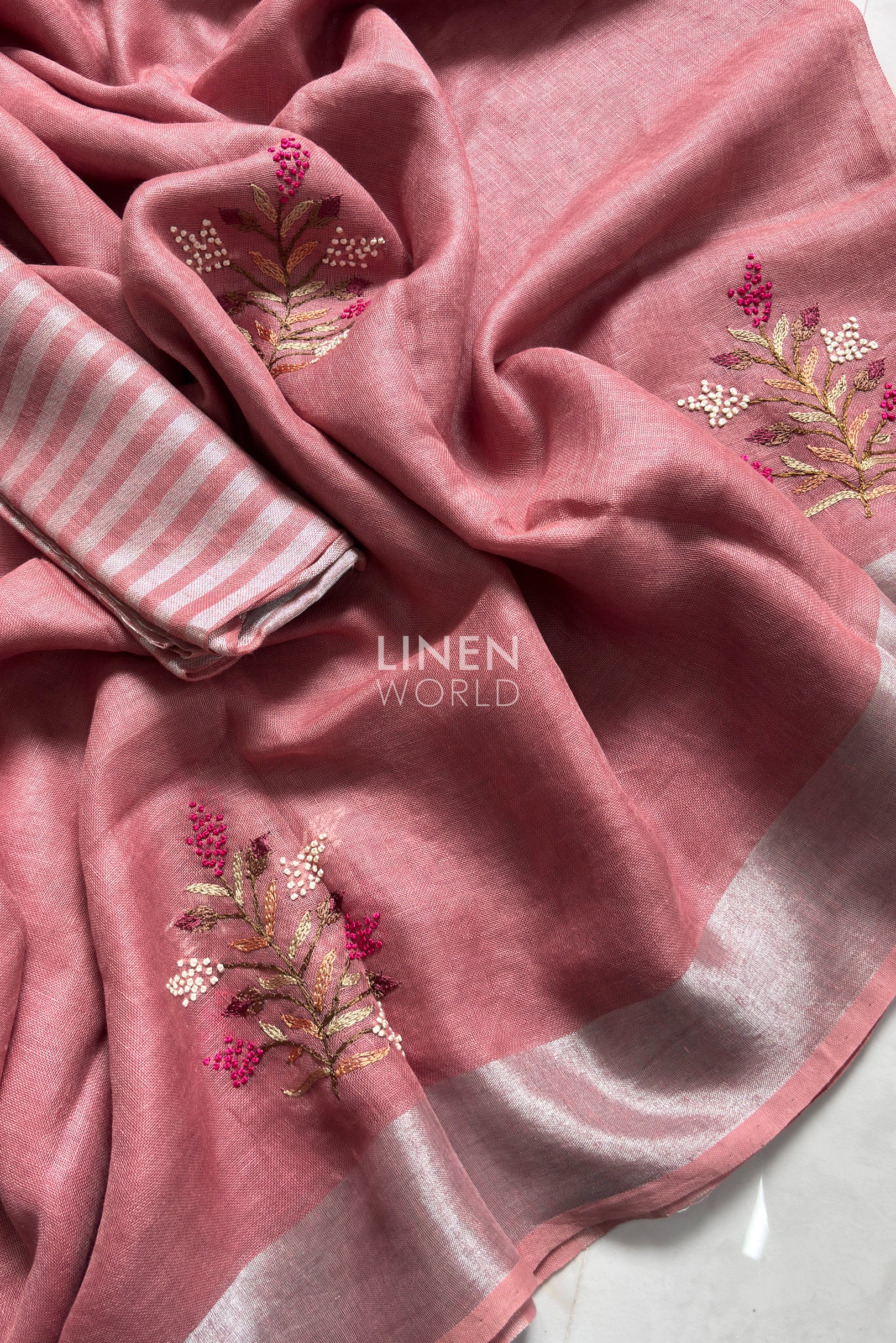 Close-up of French knot embroidery on mauve pink pure linen saree by Linen World