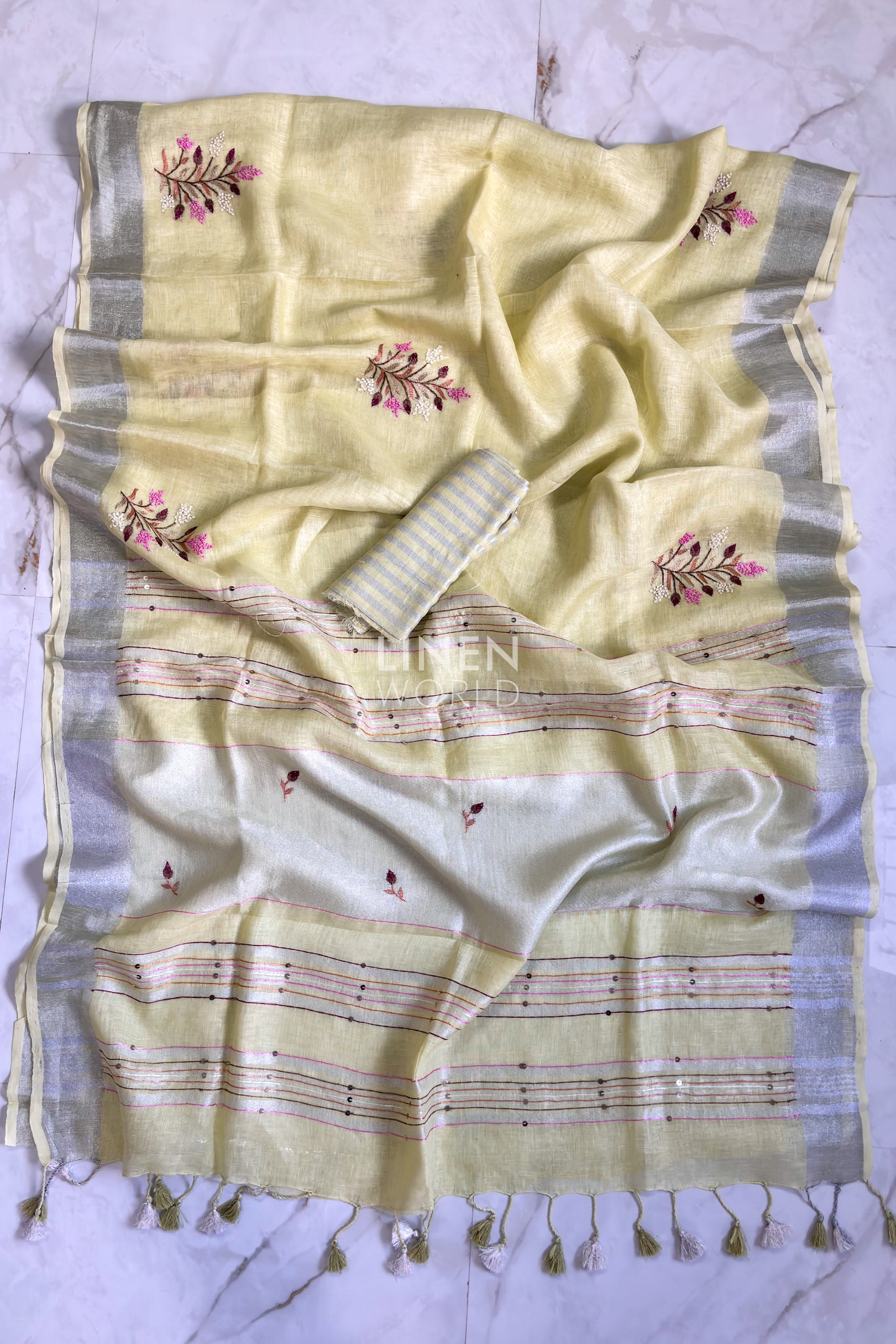 Yellow linen saree pallu showing intricate hand embroidery by Linen World